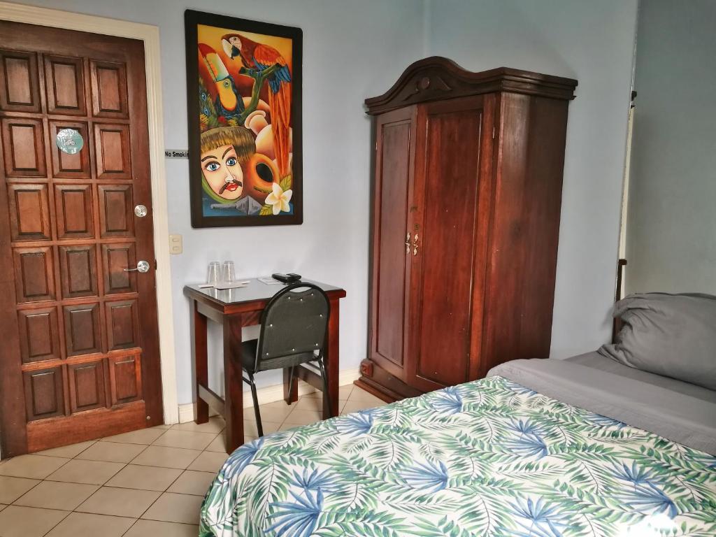 Postel nebo postele na pokoji v ubytování Hotel Casa 69