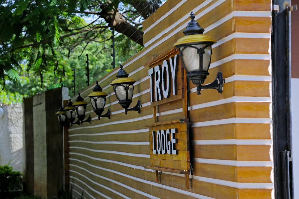 a row of lights on the side of a building at Troy Lodge in Lusaka