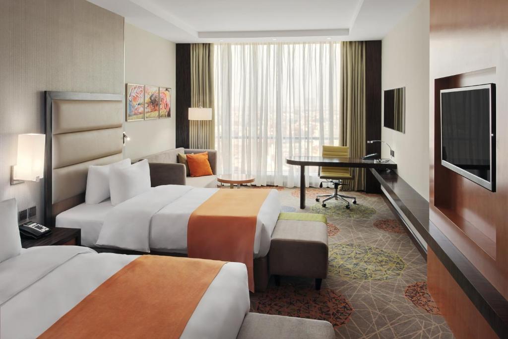 Postel nebo postele na pokoji v ubytování Holiday Inn Jeddah Gateway by IHG