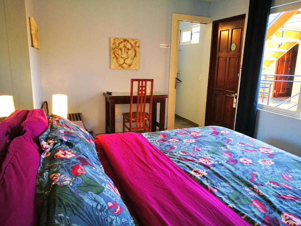 Postel nebo postele na pokoji v ubytování Hotel Casa 69