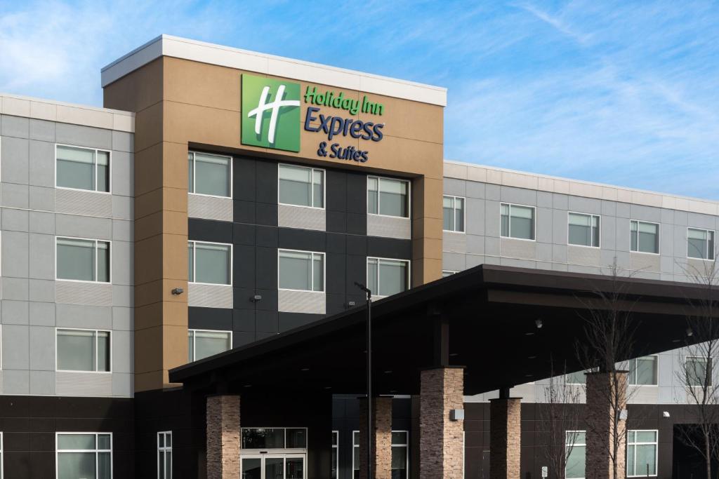 an office building with a hilton employees and skills sign on it at Holiday Inn Express & Suites - West Edmonton-Mall Area, an IHG Hotel in Edmonton
