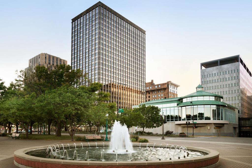 a fountain in the middle of a city with tall buildings at InterContinental St. Paul Riverfront, an IHG Hotel in Saint Paul
