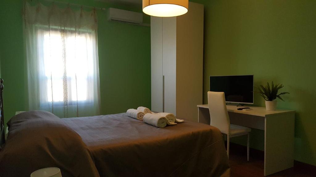 Televízia a/alebo spoločenská miestnosť v ubytovaní Pisicchio Rooms