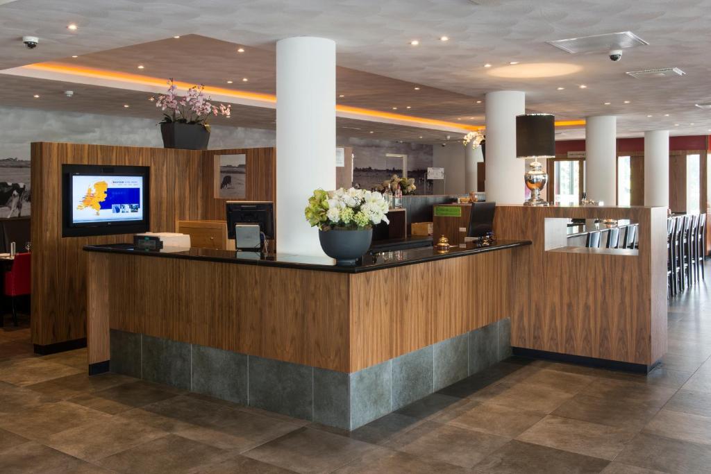 TV a/nebo společenská místnost v ubytování Bastion Hotel Den Haag Rijswijk