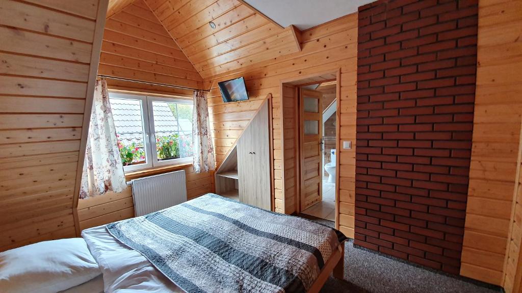 Postel nebo postele na pokoji v ubytování Agroturystyka u Jarka