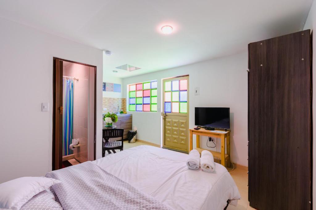 Postel nebo postele na pokoji v ubytování Hostal Doña Eliza