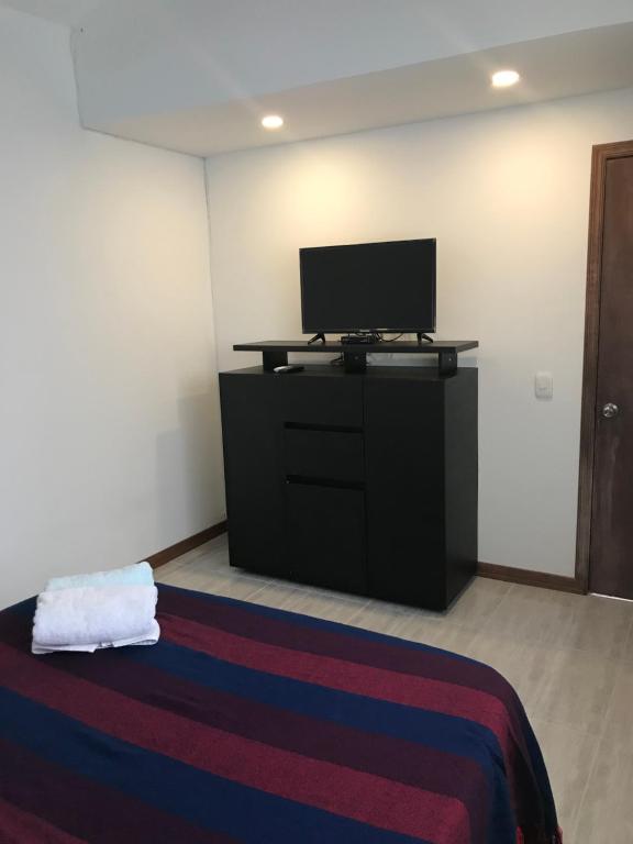 Postel nebo postele na pokoji v ubytování Hostal Doña Eliza