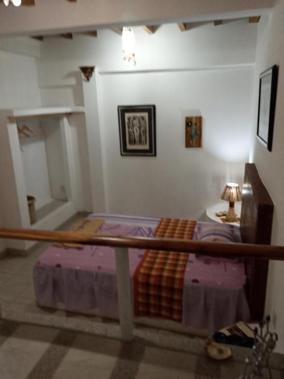 Postel nebo postele na pokoji v ubytování Hospedaje Algarrobo Machalilla