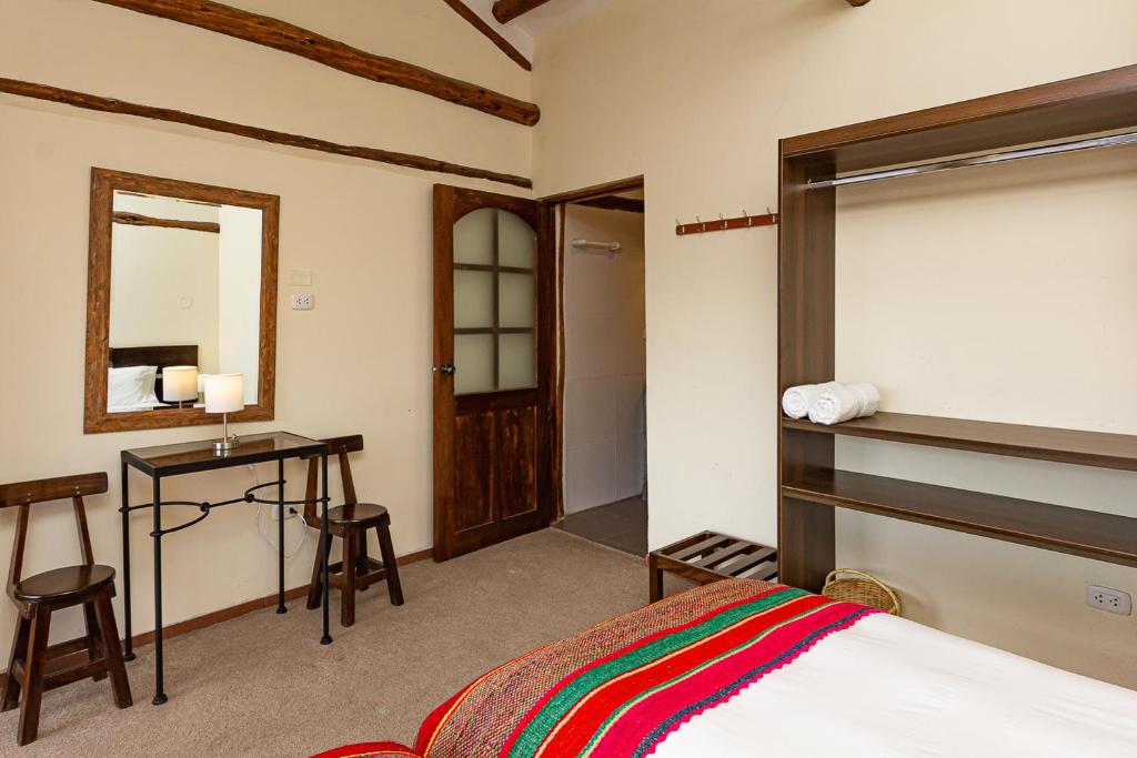 Postel nebo postele na pokoji v ubytování Luna House Cusco