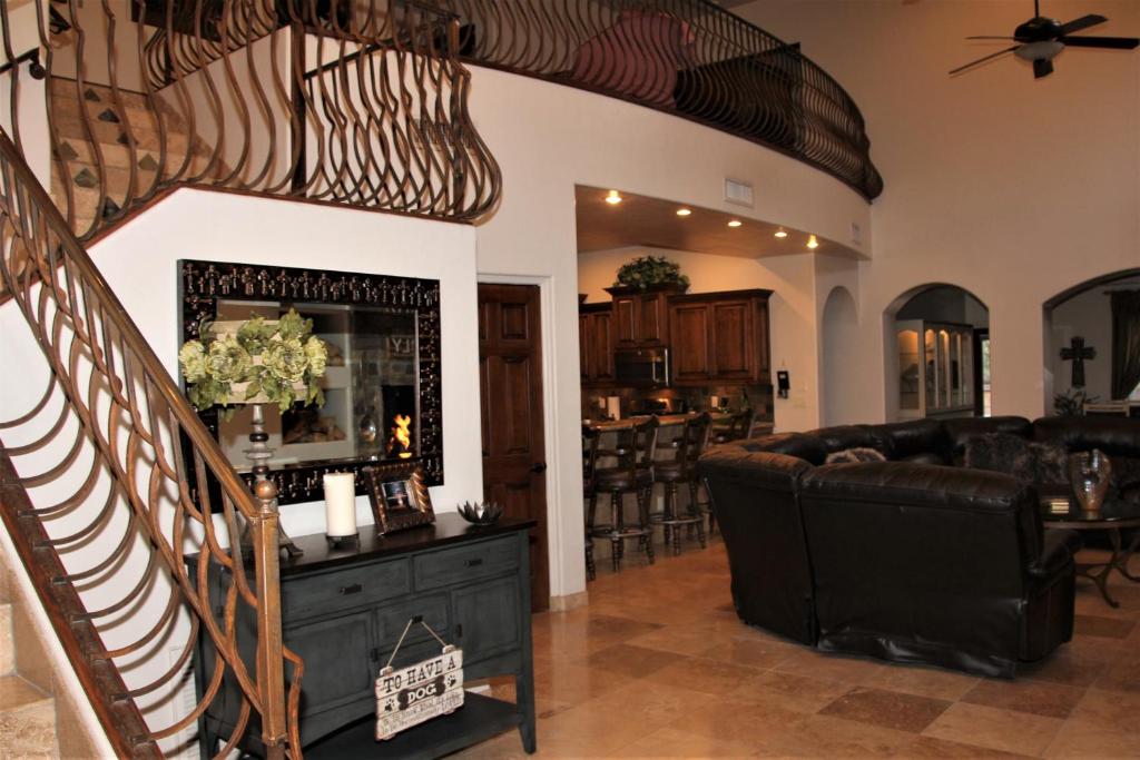 a living room with a couch and a mirror at Your Home Away From Home in Tucson