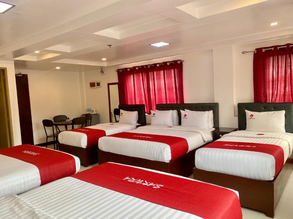 Postel nebo postele na pokoji v ubytování IL Mare Sakura Resort Boracay