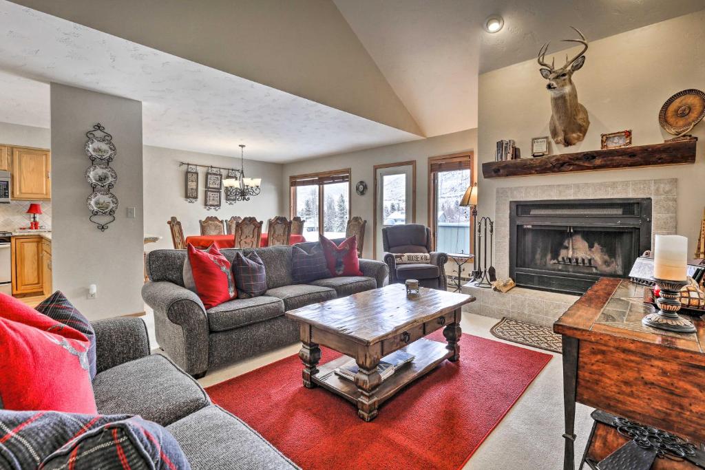 a living room with a couch and a fireplace at Eclectic Eagle-Vail Condo 2 Miles to Beaver Creek in Beaver Creek
