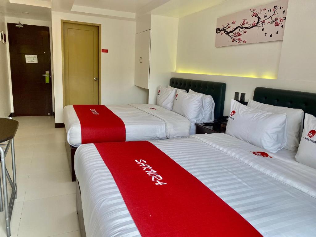 Postel nebo postele na pokoji v ubytování IL Mare Sakura Resort Boracay