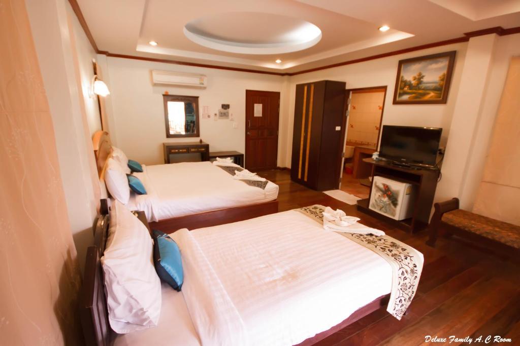 Postel nebo postele na pokoji v ubytování Wind Beach Resort