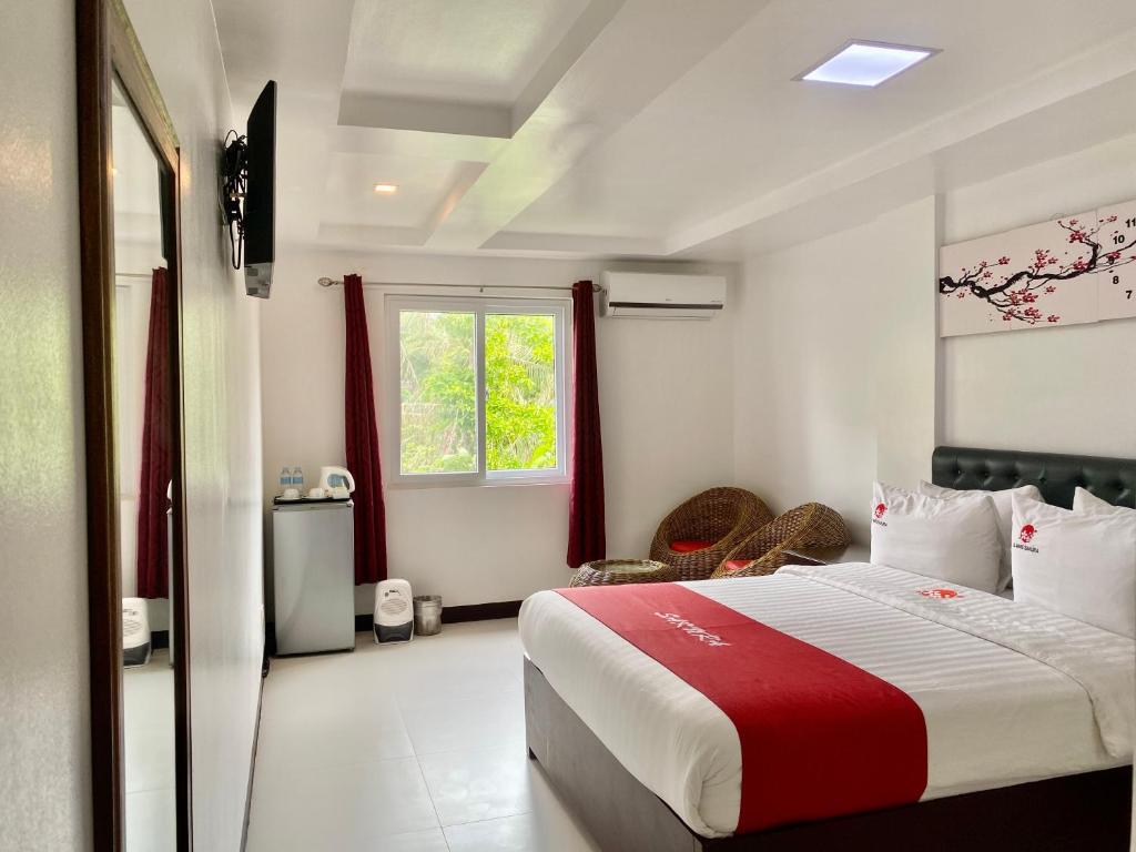 Postel nebo postele na pokoji v ubytování IL Mare Sakura Resort Boracay