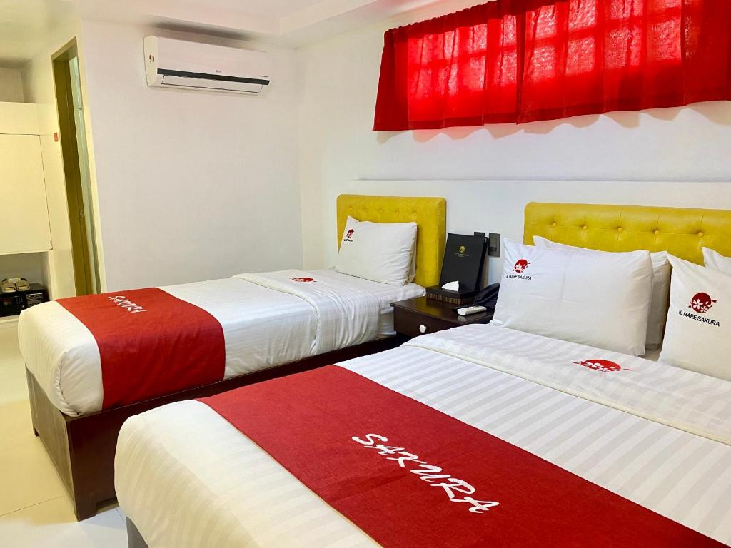 Postel nebo postele na pokoji v ubytování IL Mare Sakura Resort Boracay
