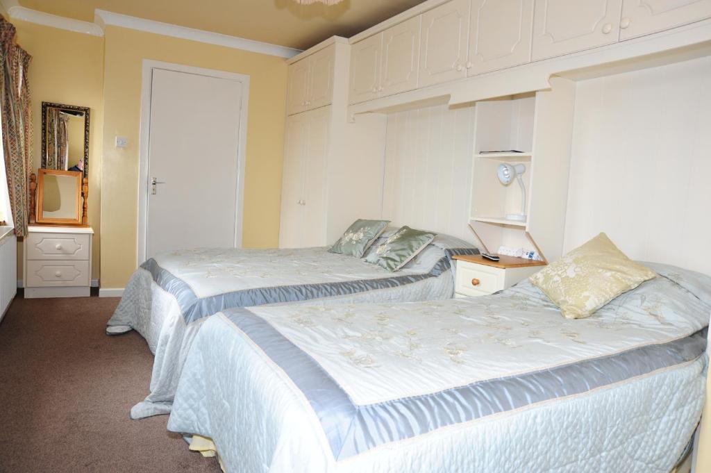 two beds in a room with two beds sidx sidx sidx at The Mill Bar in Athlone