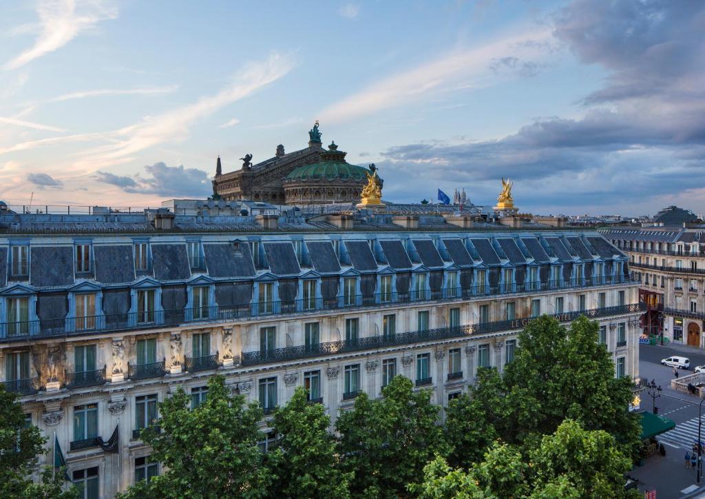 a large white building with a dome on top of it at InterContinental Paris Le Grand by IHG in Paris