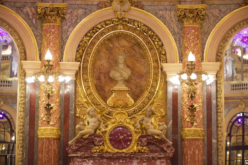 a gold altar in a building with a statue at InterContinental Paris Le Grand by IHG in Paris