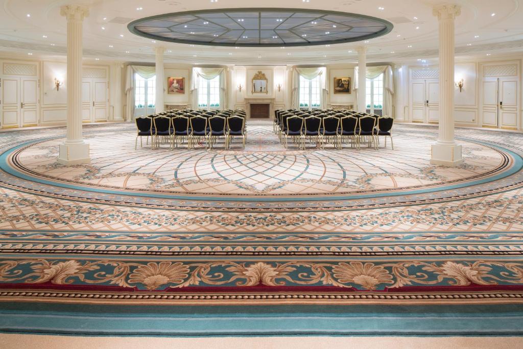 a ballroom with chairs and a large carpet at InterContinental Paris Le Grand by IHG in Paris