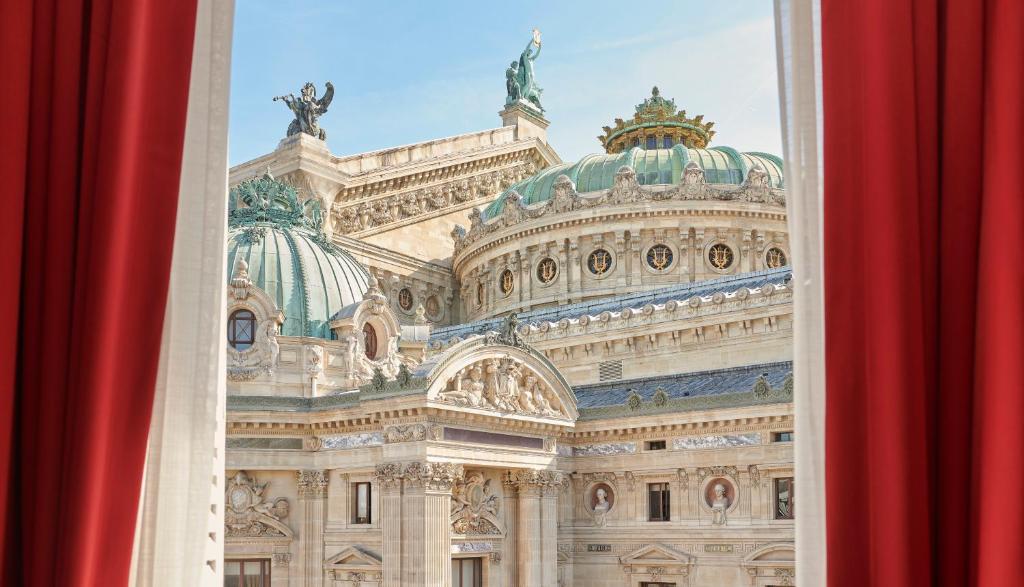 a view of the parliament building from a window at InterContinental Paris Le Grand, an IHG Hotel in Paris