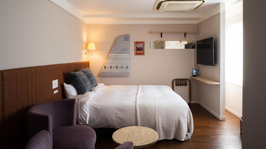 Postel nebo postele na pokoji v ubytování miss morgan hotel