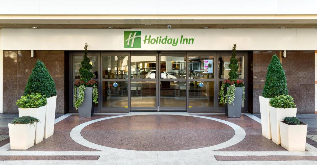 a building with a sign on the front of it at Holiday Inn London Bloomsbury, an IHG Hotel in London