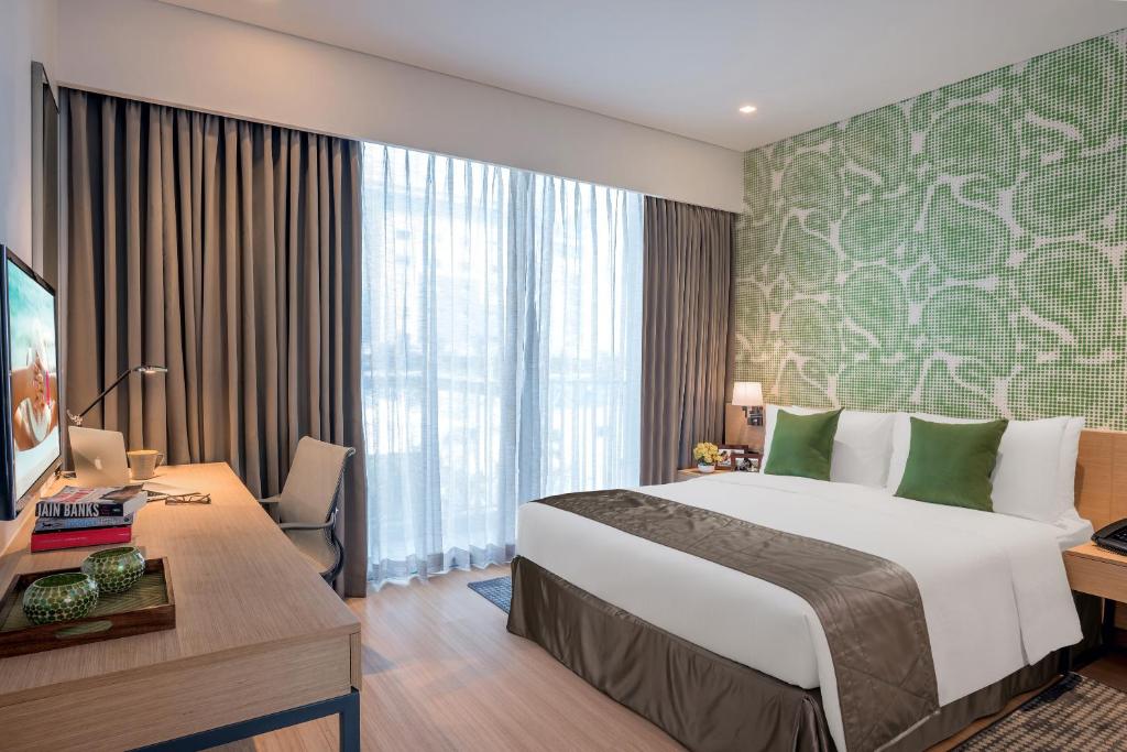 Postel nebo postele na pokoji v ubytování Citadines OMR Chennai