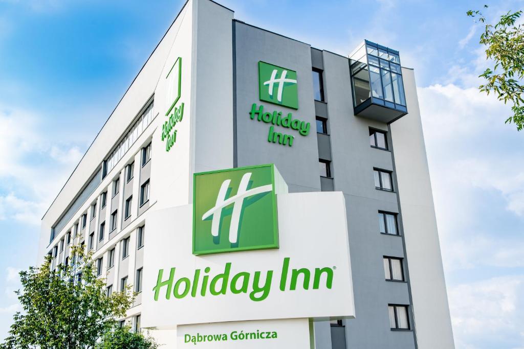 a building with the hudley inn sign on it at Holiday Inn Dąbrowa Górnicza-Katowice, an IHG Hotel in Dąbrowa Górnicza