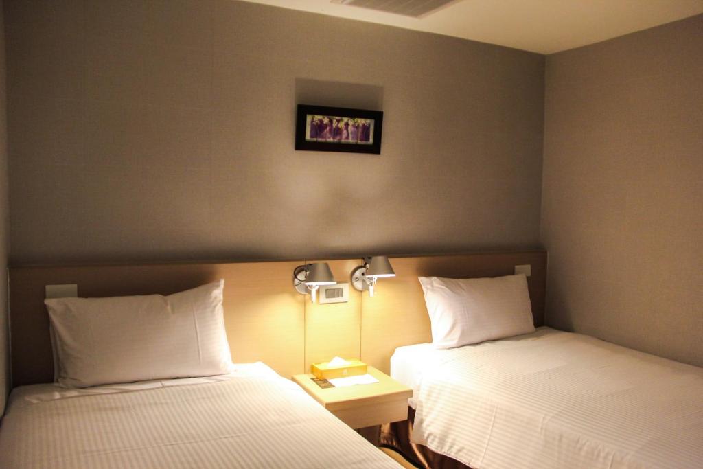 Postel nebo postele na pokoji v ubytování Mellow Fields Hotel