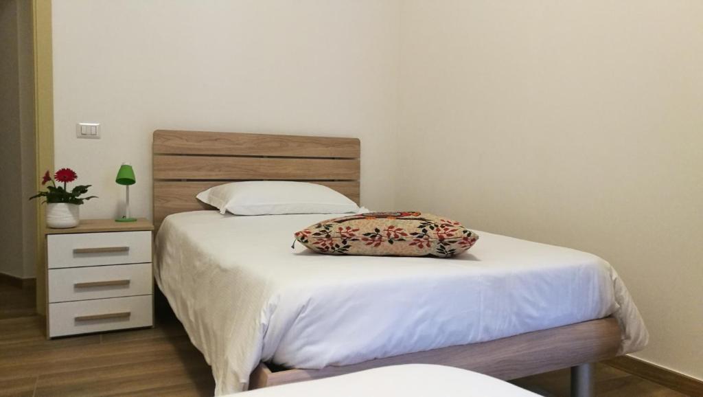Łóżko lub łóżka w pokoju w obiekcie EApartmentsfoligno