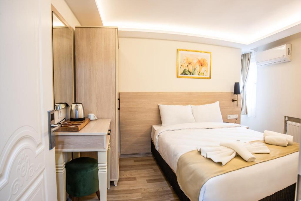 Postel nebo postele na pokoji v ubytování Royal Bosphorus Hotel & SPA Hamam