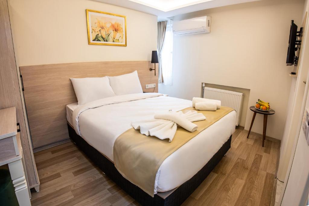 Postel nebo postele na pokoji v ubytování Royal Bosphorus Hotel & SPA Hamam