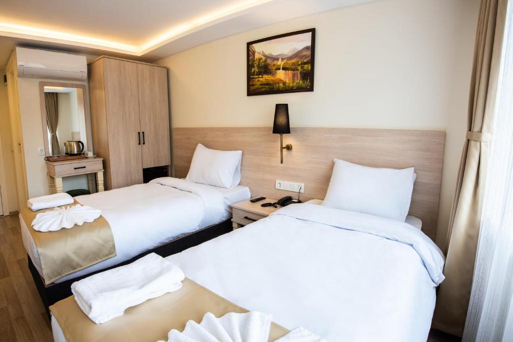 Postel nebo postele na pokoji v ubytování Royal Bosphorus Hotel & SPA Hamam