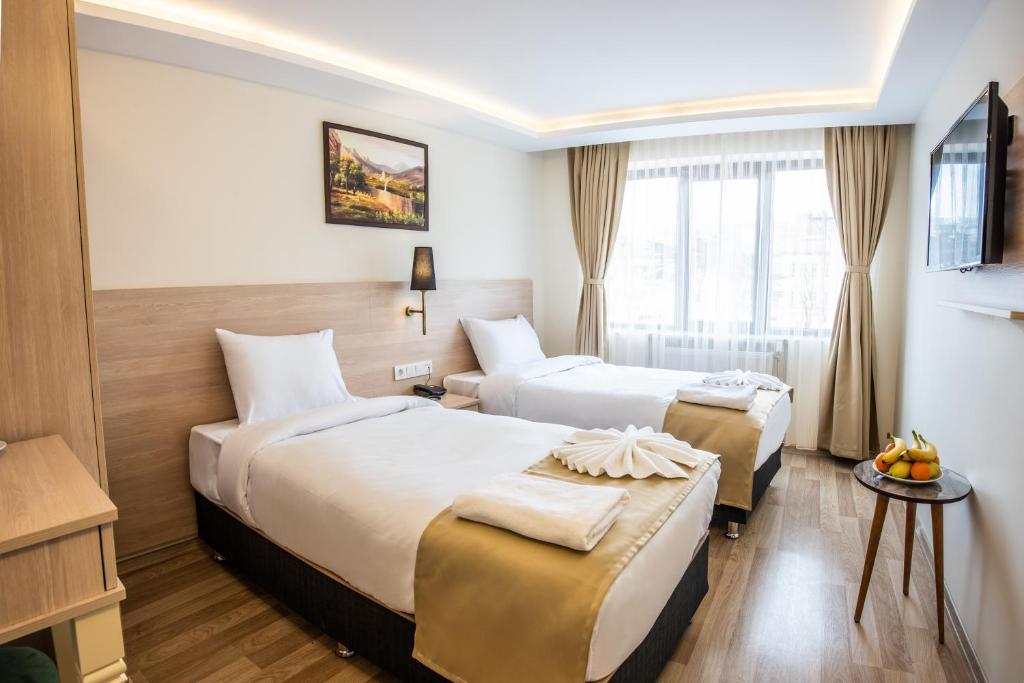 Postel nebo postele na pokoji v ubytování Royal Bosphorus Hotel & SPA Hamam