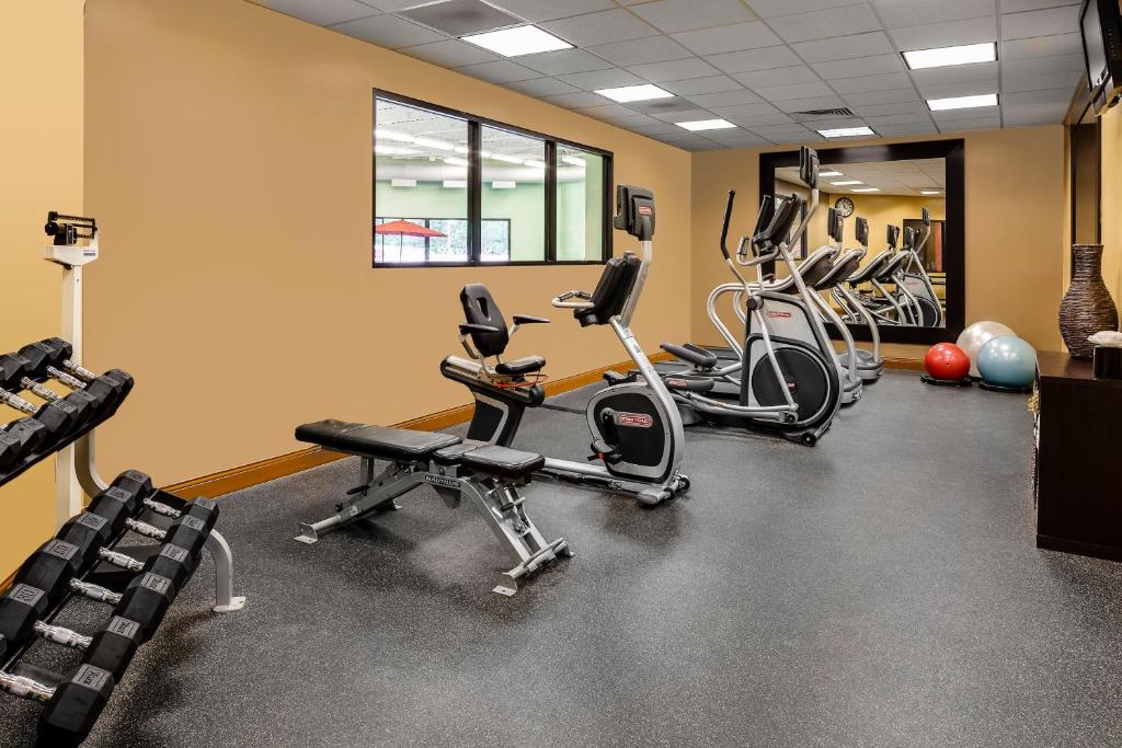 a gym with several treadmills and exercise bikes at Holiday Inn Wichita East I-35 by IHG in Wichita