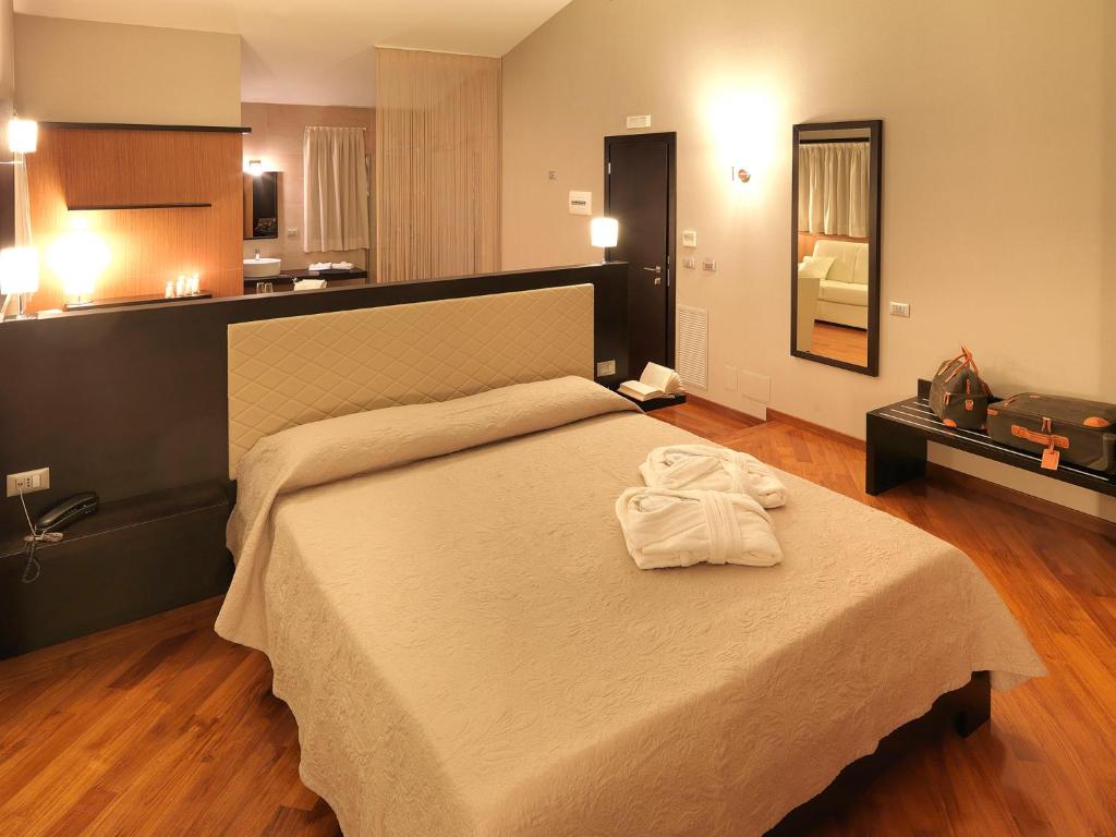 Postel nebo postele na pokoji v ubytování Il Castagneto Hotel