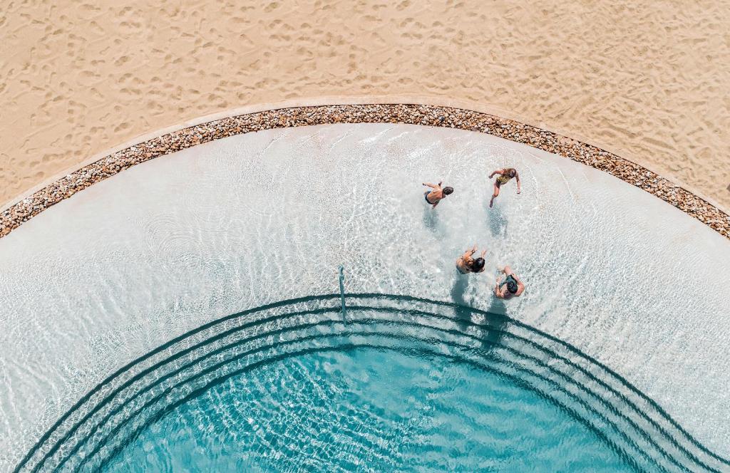 an overhead view of people in a swimming pool at Mitsis Norida in Kardamaina
