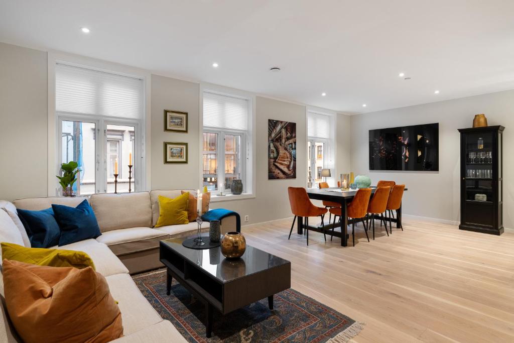 a living room with a couch and a table at Keyser Apartments 6 in Bergen