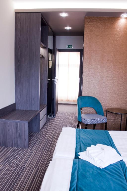 Postel nebo postele na pokoji v ubytování Relax Panzió