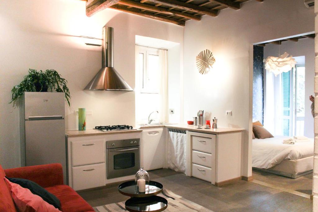 a kitchen with a sink and a stove in a room at Chilling'Monti in Rome