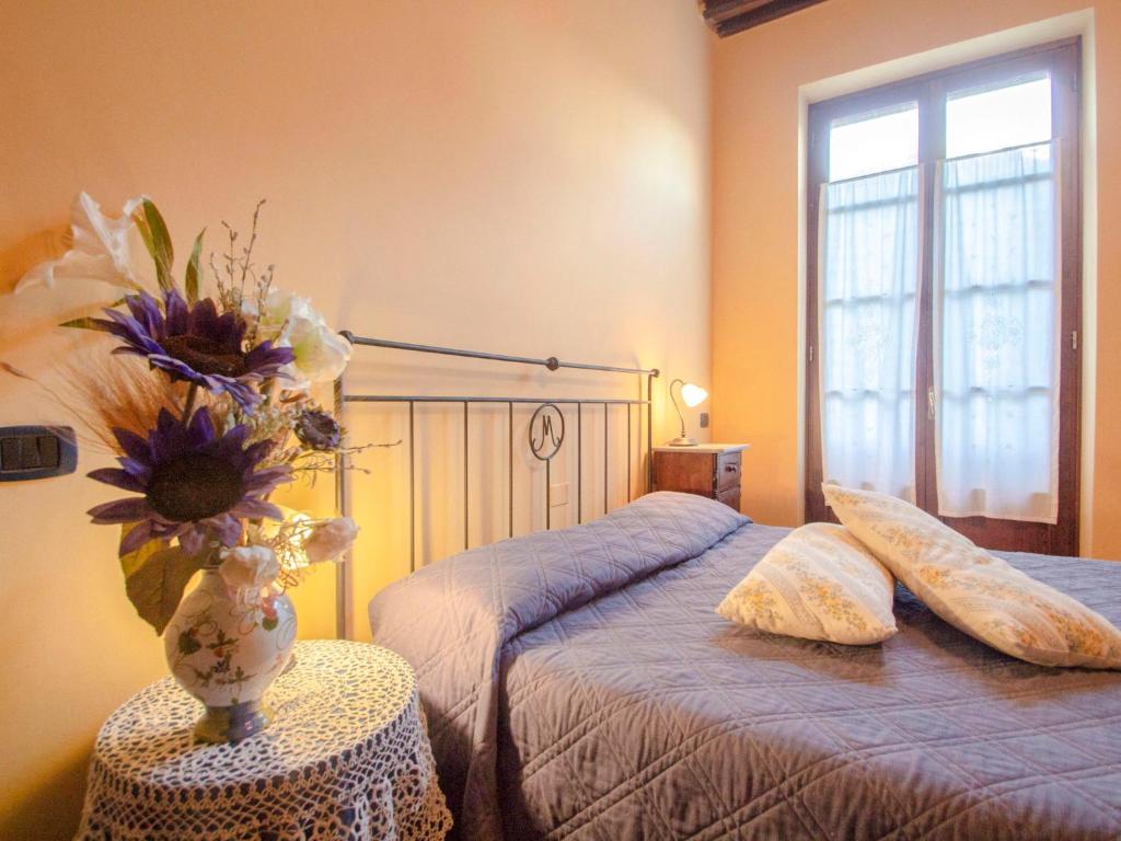 A bed or beds in a room at Holiday Home Capanna di Sopra by Interhome