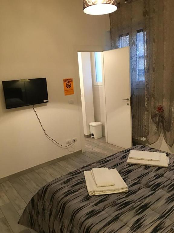 A bed or beds in a room at Affittacamere Real Fly