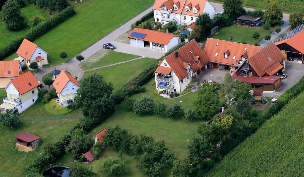 an overhead view of a large house with red roofs at Ferienanlage Karolinenhof 2 in Haundorf