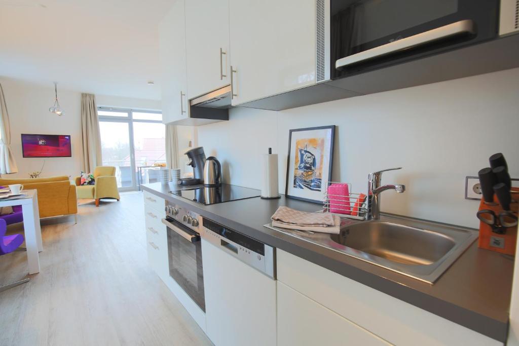 Kuchyň nebo kuchyňský kout v ubytování Appartements Villa Schwanenteich
