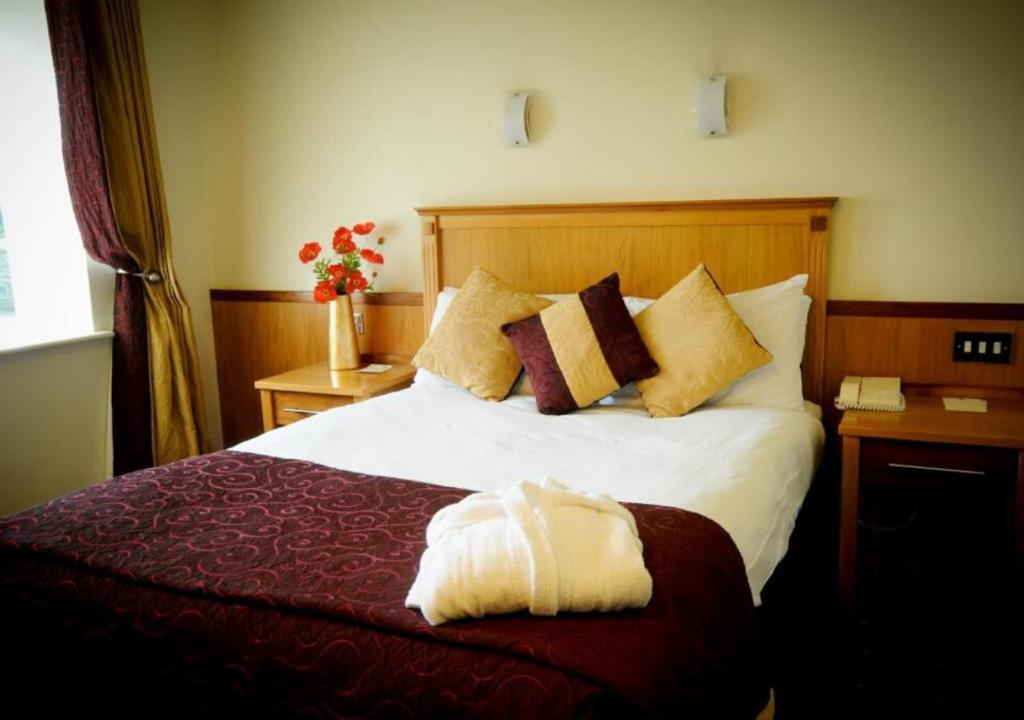 Postel nebo postele na pokoji v ubytování Bush Hotel