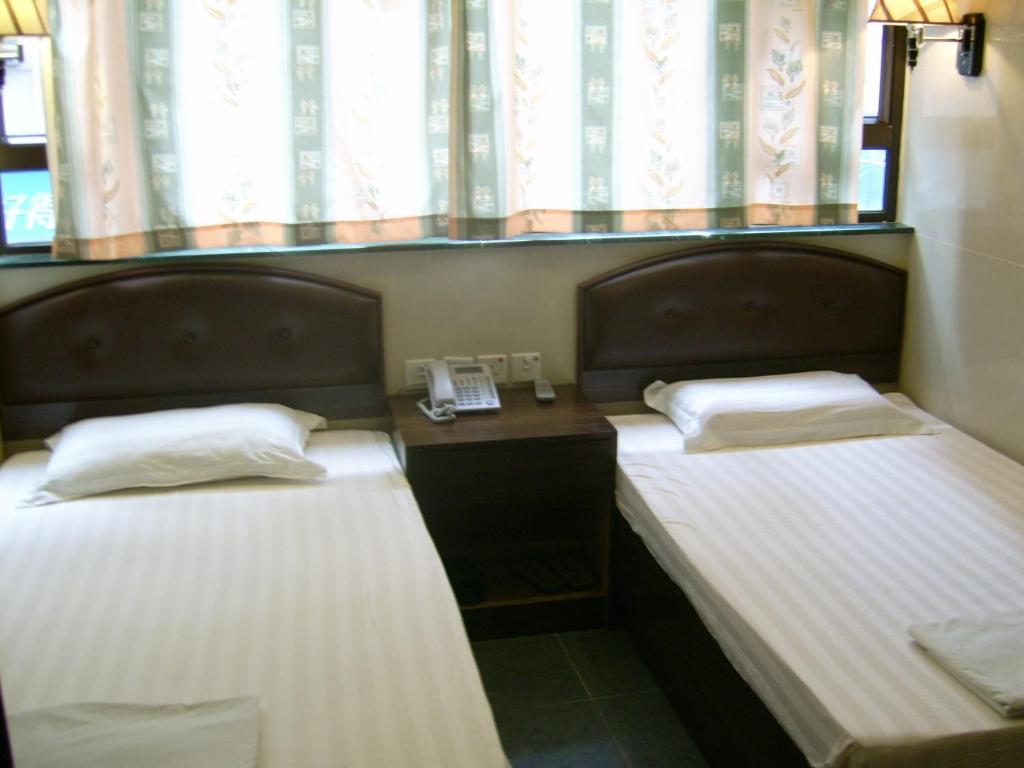 Postel nebo postele na pokoji v ubytování Hong Kong CoLiving Space