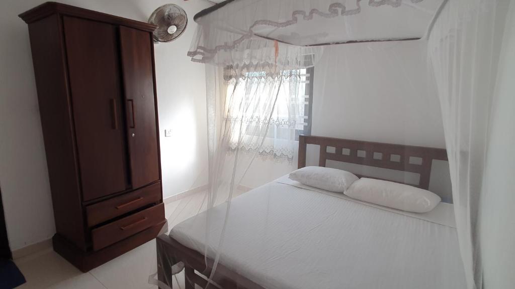 Letto o letti in una camera di Bandulas Beach House