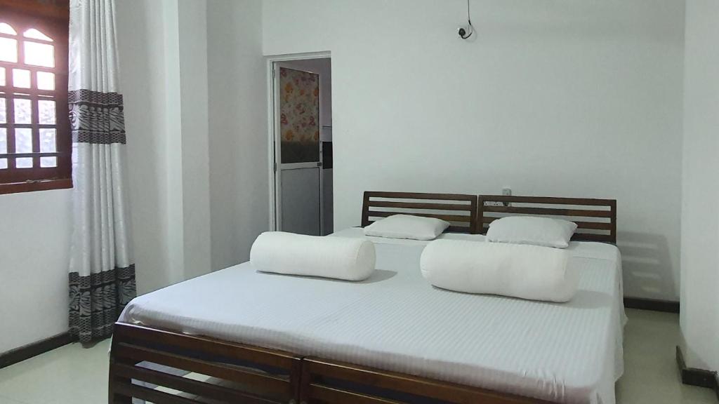 Letto o letti in una camera di Bandulas Beach House