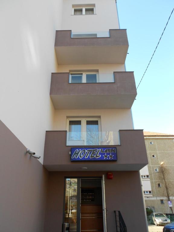 a building with a sign for a hotel at Hostel Lan in Oradea